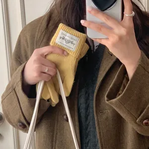Mustard yellow warm knitted winter gloves for women with touchscreen compatibility