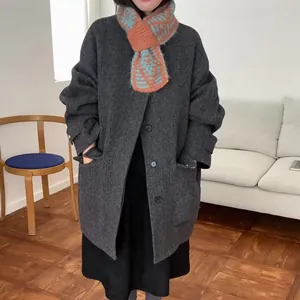 Stylish striped cross-over knitted wool scarf for women in vibrant orange and teal