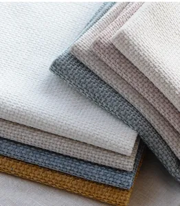 Dettaglio del tessuto ciniglia con trama a nido d'ape in vari colori pastello.