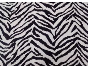 Primo piano tessuto ciniglia con stampa zebrata, classico motivo jacquard in bianco e nero.