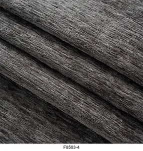 Vista macro dettagliata del tessuto ciniglia grigio scuro con morbida trama a coste
