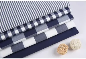Stacked blue and white plaid and striped imitation cotton linen fabrics for DIY crafts