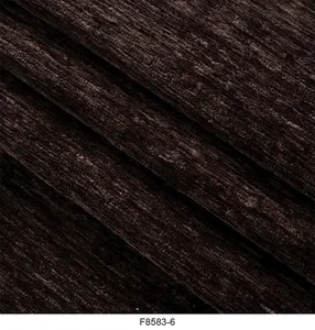 Vista macro dettagliata del tessuto ciniglia marrone cioccolato con trama a coste