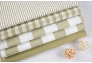 Stacked sage green cotton-linen fabrics with stripes and checks for DIY projects