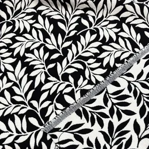 Tessuto jacquard in ciniglia bianco e nero con motivo botanico di foglie per tappezzeria