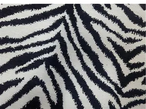 Tessuto jacquard chenille con motivo zebrato bianco e nero per divano e cuscini moderni.