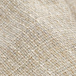 Detailed macro shot of luxury Chanel-style tweed fabric with shimmering silver thread