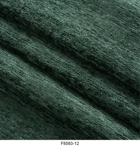 Vista dettagliata del tessuto in ciniglia verde scuro per cuscini e tappezzeria