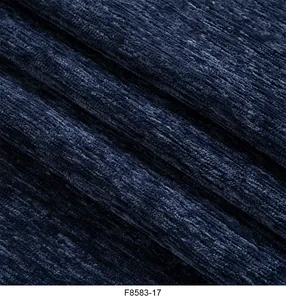 Macro primo piano della trama del tessuto ciniglia blu scuro per rivestimento divano