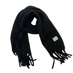 Stylish thick black wool scarf with fringe tassels featuring UNDERSON brand woven label