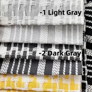 Stacked samples of woven cotton and linen fabric for sofas and home decorations
