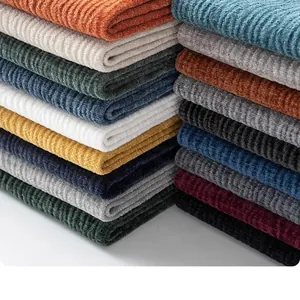 Close-up of colorful ribbed chenille fabric stacks for sofas or clothing
