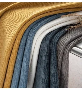 Detailed view showing multiple colors of soft chenille upholstery fabric with petal texture