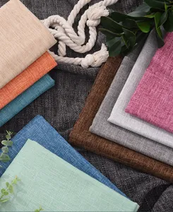 Close-up macro shot of multi-colored cotton linen fabric swatches for sofa and DIY crafts