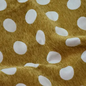 Tessuto jacquard in ciniglia giallo senape a grandi pois bianchi per l'arredo di casa