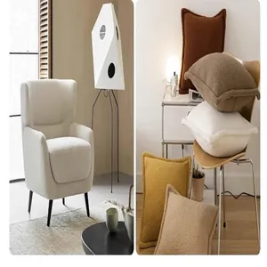 Detail view of high-grade thick solid color plush fabric on armchair and cushions
