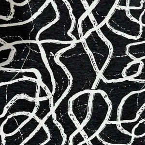 Trama dettagliata del tessuto jacquard di ciniglia bianco e nero con motivo a linee astratte