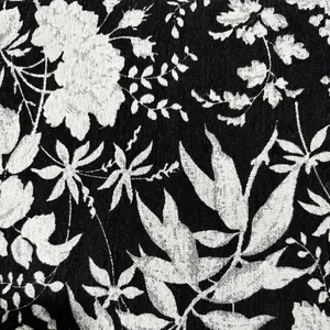 Dettaglio macro del tessuto jacquard in ciniglia botanica bianca e nera per divano
