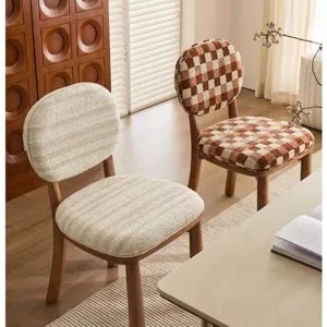 Two modern chairs upholstered in checkered and striped chenille jacquard fabric