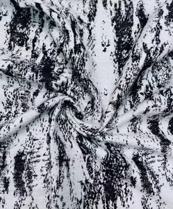 Close-up view of black and white ink painting style polyester velvet fabric texture
