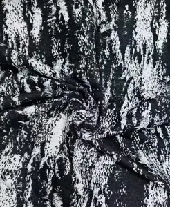 Macro detail of black and white abstract water ink pattern polyester fabric texture