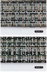 Detailed view of textured woven tweed fabric swatches in blue and green plaid designs.