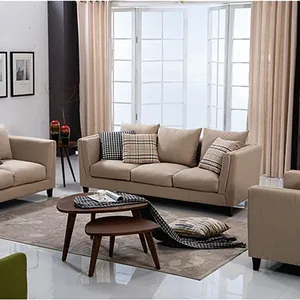Detail view of thick linen fabric sofa covers and pillows in a cozy living room