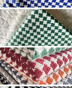 Detailed macro view showing colorful houndstooth woven cotton linen fabric textures
