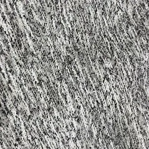 Primer plano de elegante textura de tela de tweed blanca y negra para ropa de alta gama