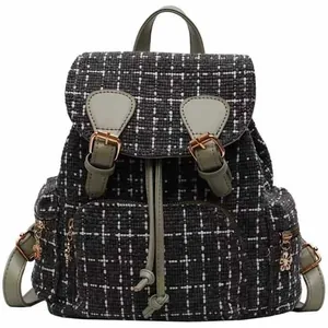 Detailed view of the stylish plaid backpack featuring durable tweed fabric and elegant green straps.