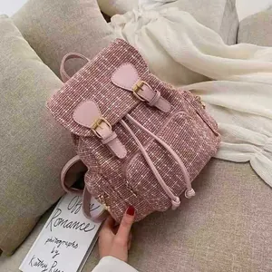 Pink tweed backpack with leather straps and double shoulder design for women daily wear.