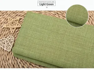 Gedetailleerde macro-weergave van de natuurlijke textuur van lichtgroene linnen stof
