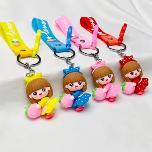 Set of 4 cute PVC girl doll keychains with peaches and colorful wrist straps for keys