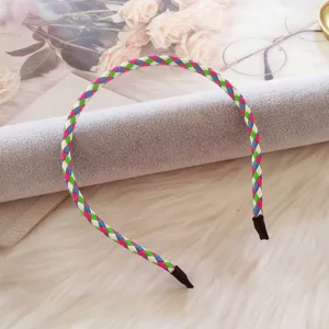 Detailed close-up showing the intricate multi-colored braided pattern of this PU leather headband