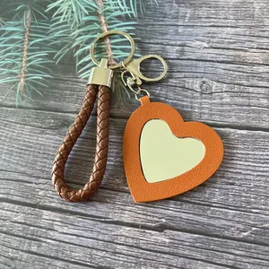 Porte-clés élégant en cuir en forme de cœur avec miroir et cordon tressé marron