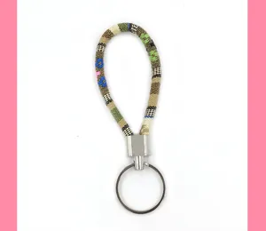 Macro view of ethnic style woven fabric lanyard keychain with durable silver metal ring