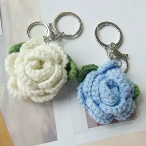 Handmade crochet rose flower keychains in white and blue colors for backpack charm decor