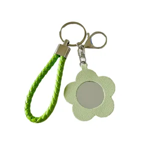Portachiavi specchio fiore in pelle verde elegante con cinturino intrecciato ciondolo borsa
