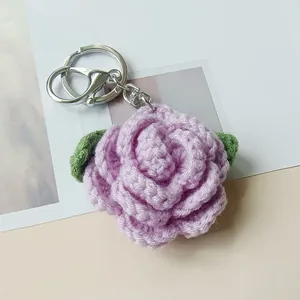 Handmade purple crocheted rose flower keychain with green leaves and silver metal ring clasp