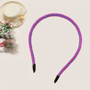 Detailed view of pink and blue braided PU leather headband for children