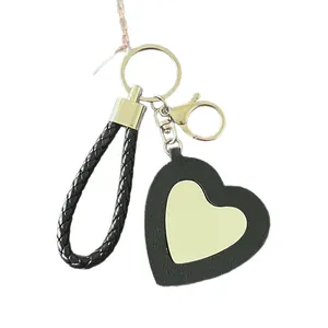 Porte-clés miroir en forme de cœur avec cadre en cuir noir et cordon tressé pour sacs