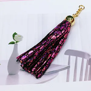 Fuchsia leather tassel keychain with gold cap for bag charm decoration