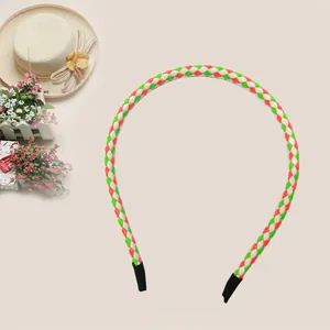 Close-up view of a colorful braided PU leather headband featuring red, white and green pattern