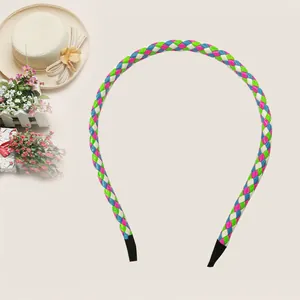 Close-up of a colorful braided PU leather headband for kids with a summer hat background.