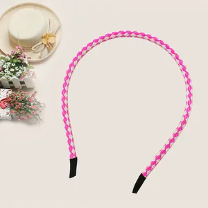 Detail view of pink and white braided PU leather headband for children