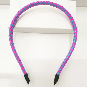 Detailed view of the pink and blue braided PU leather headband design