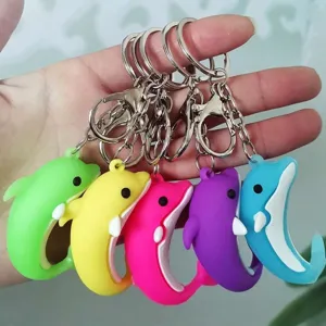 Detail view of colorful dolphin-shaped silicone keychains with metal lobster clasps