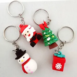 Selection of 4 Christmas silicone keychains including Santa, snowman, and tree