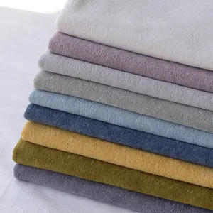 Stack of premium multi-colored thickened plush velvet fabrics for DIY home textile projects.