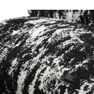 Macro view of black and white ink wash style faux mink fabric for sofa cushions